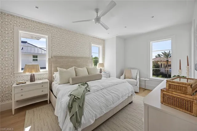 a bedroom with bed and window