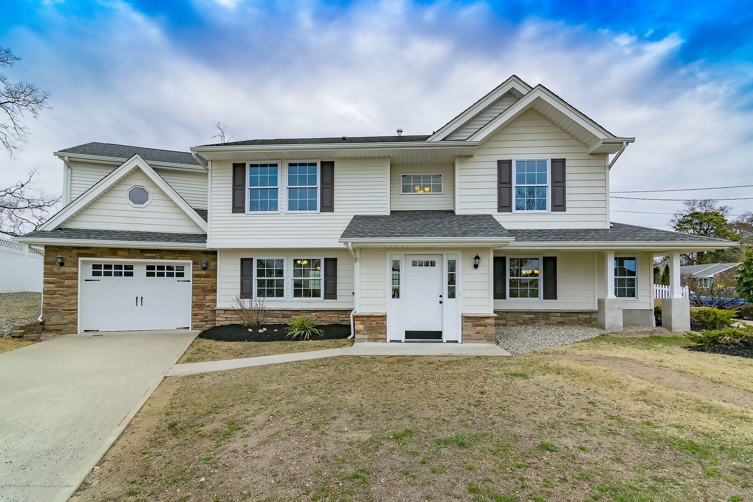 1521 Treeneedle Road Point Pleasant, NJ 08742 - Photo 1 of 33 a front view of a house with a yard