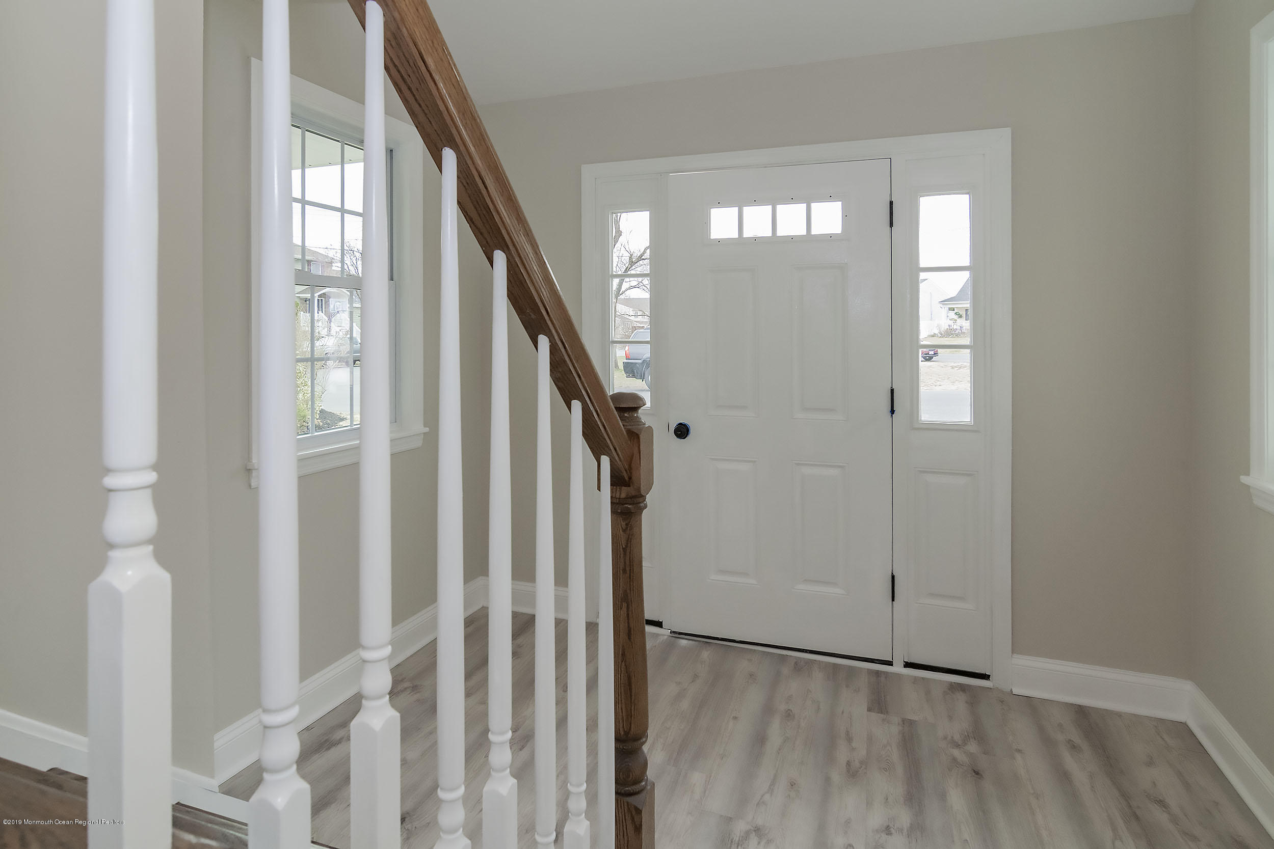 1521 Treeneedle Road Point Pleasant, NJ 08742 - Photo 19 of 33 a view of an entryway with wooden floor and stairs