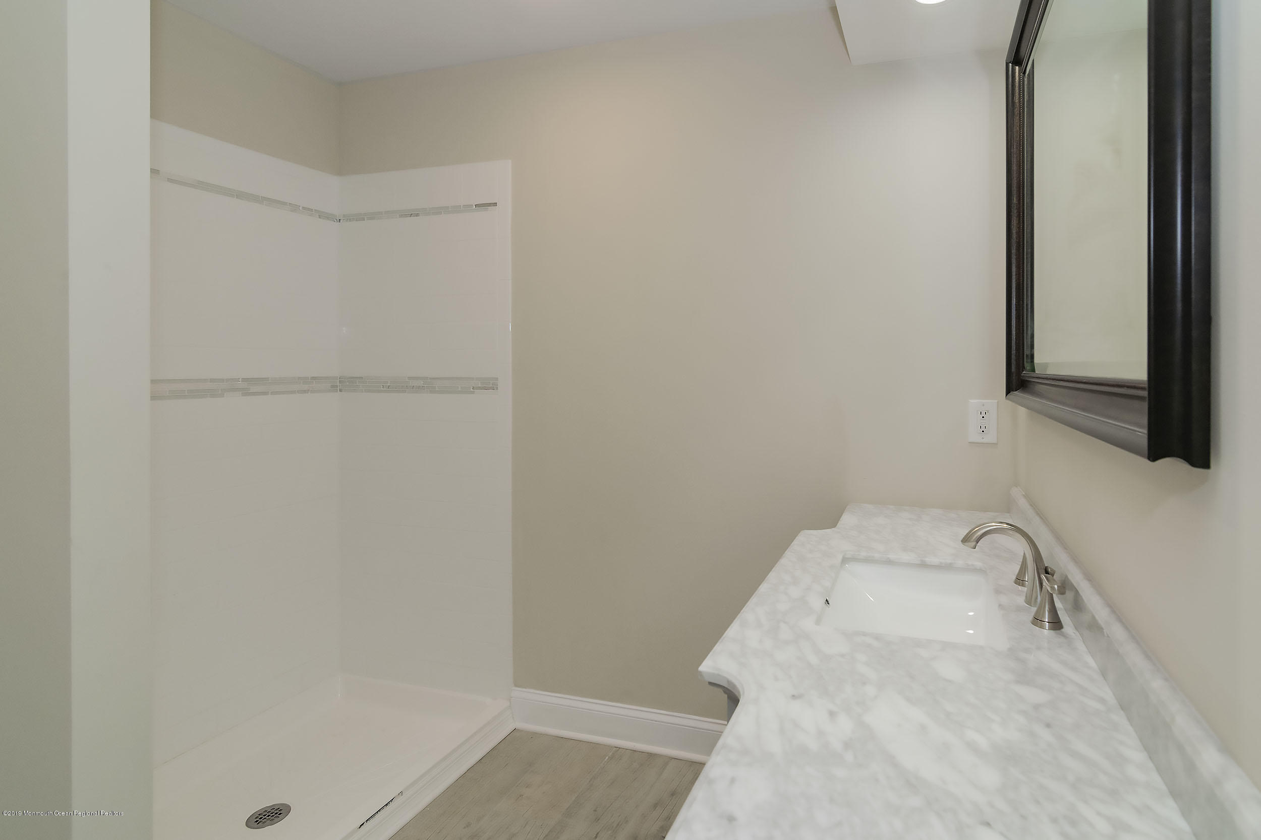 1521 Treeneedle Road Point Pleasant, NJ 08742 - Photo 22 of 33 a bathroom with a sink and vanity