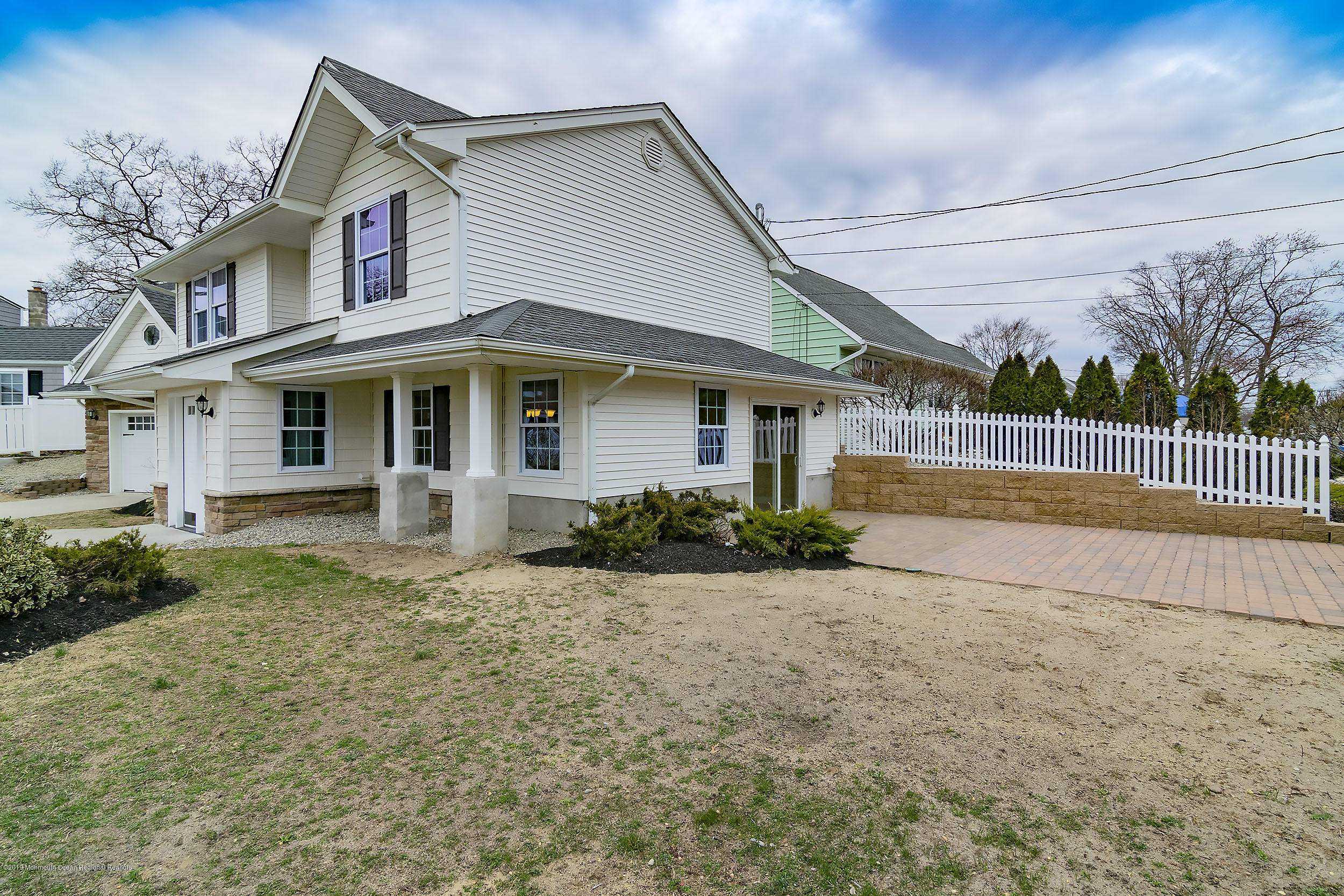 1521 Treeneedle Road Point Pleasant, NJ 08742 - Photo 33 of 33 a front view of a house with a garden
