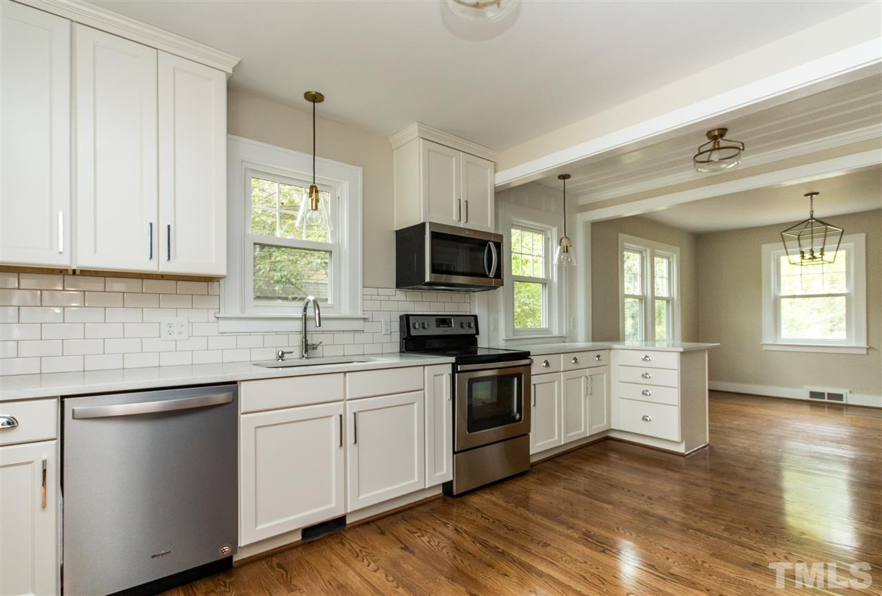 2503 Mayview Road Raleigh, NC 27607 - Photo 11 of 20 a kitchen with a sink stove and microwave