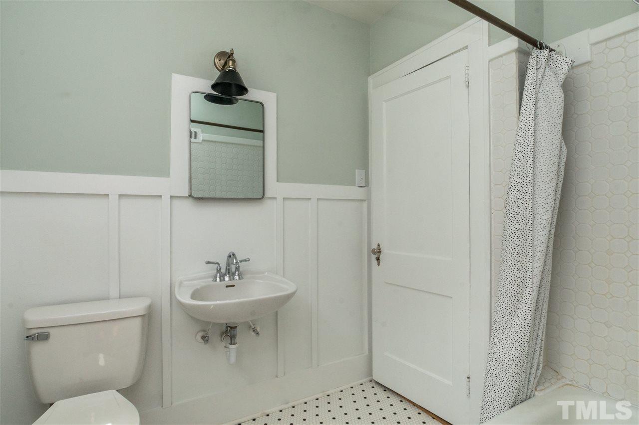 2503 Mayview Road Raleigh, NC 27607 - Photo 16 of 20 a bathroom with a sink toilet and shower