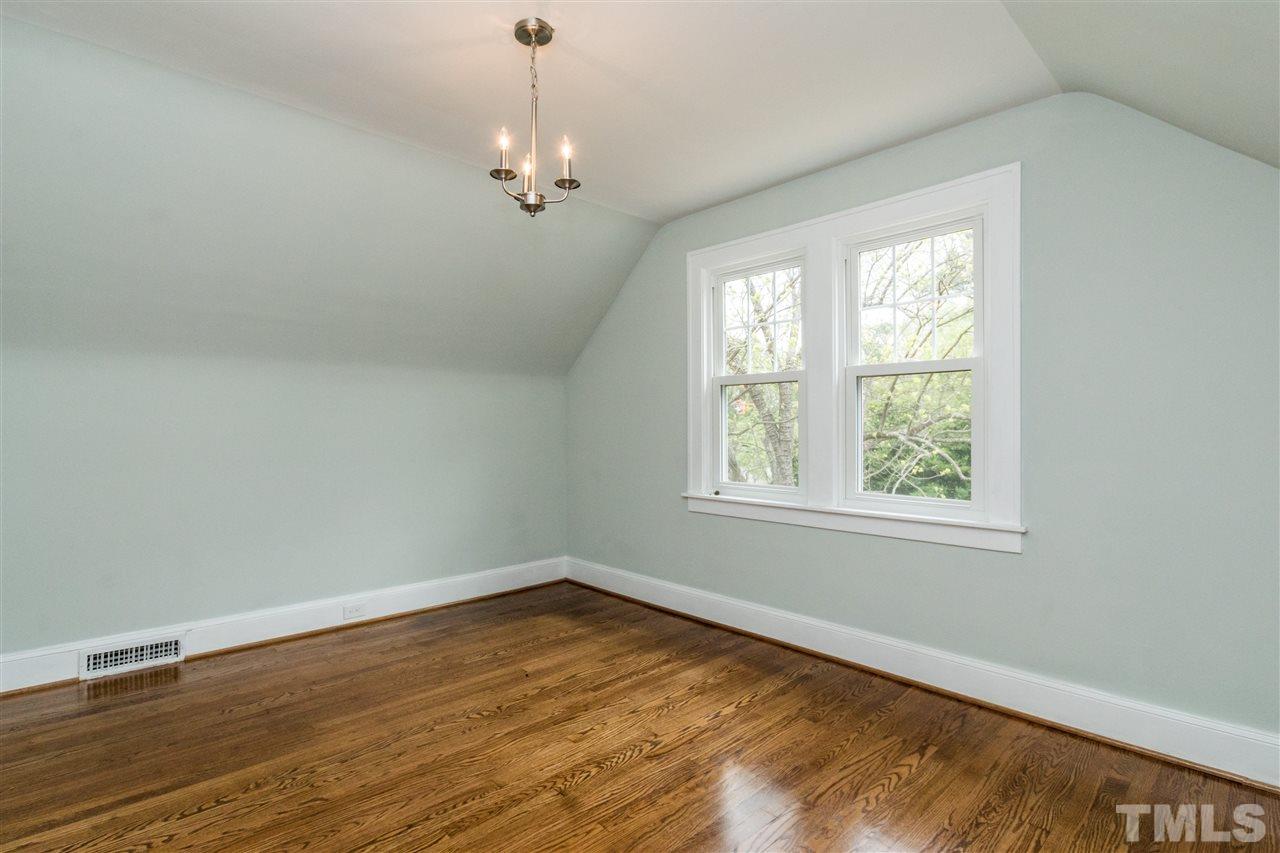 2503 Mayview Road Raleigh, NC 27607 - Photo 19 of 20 an empty room with wooden floor and windows
