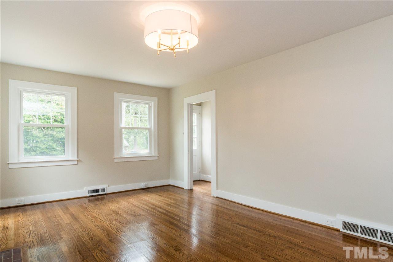 2503 Mayview Road Raleigh, NC 27607 - Photo 5 of 20 an empty room with wooden floor and window