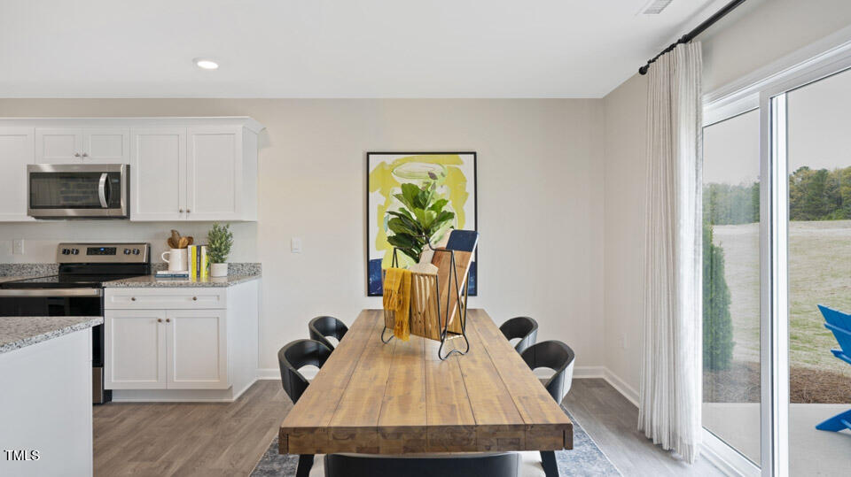 5917 Sodium Street Raleigh, NC 27610 - Photo 14 of 24 a view of a workspace with furniture and a window
