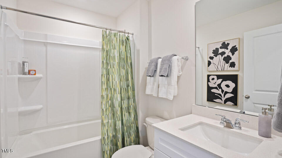 5917 Sodium Street Raleigh, NC 27610 - Photo 19 of 24 a bathroom with a sink and a mirror