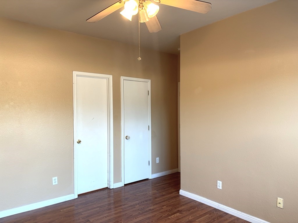 2869 Southampton Way, Unit B Round Rock, TX 78664 - Photo 11 of 19 Primary bedroom with laminate flooring and ceiling fan.