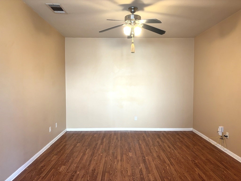 2869 Southampton Way, Unit B Round Rock, TX 78664 - Photo 4 of 19 Living room with neutral paint, laminate flooring and ceiling fan.