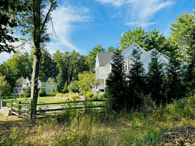 a view of a house with a big yard