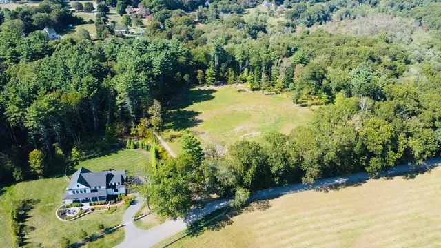 a view of a garden with an outdoor seating