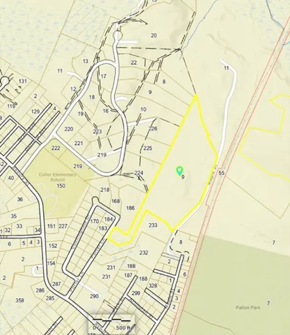 a front view of a house with lots of board and garage