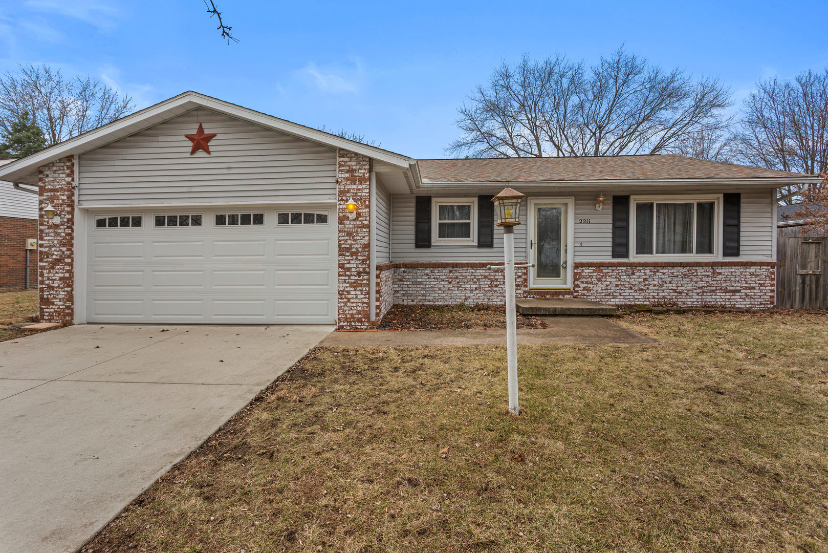 2211 Carlisle Drive Champaign, IL 61821 - Photo 1 of 34 a front view of a house with garden