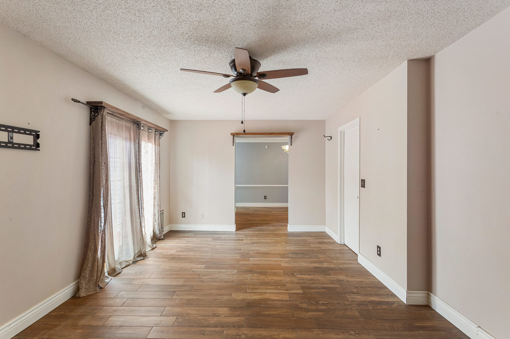 2211 Carlisle Drive Champaign, IL 61821 - Photo 16 of 34 a view of a hallway with wooden floor and a ceiling fan