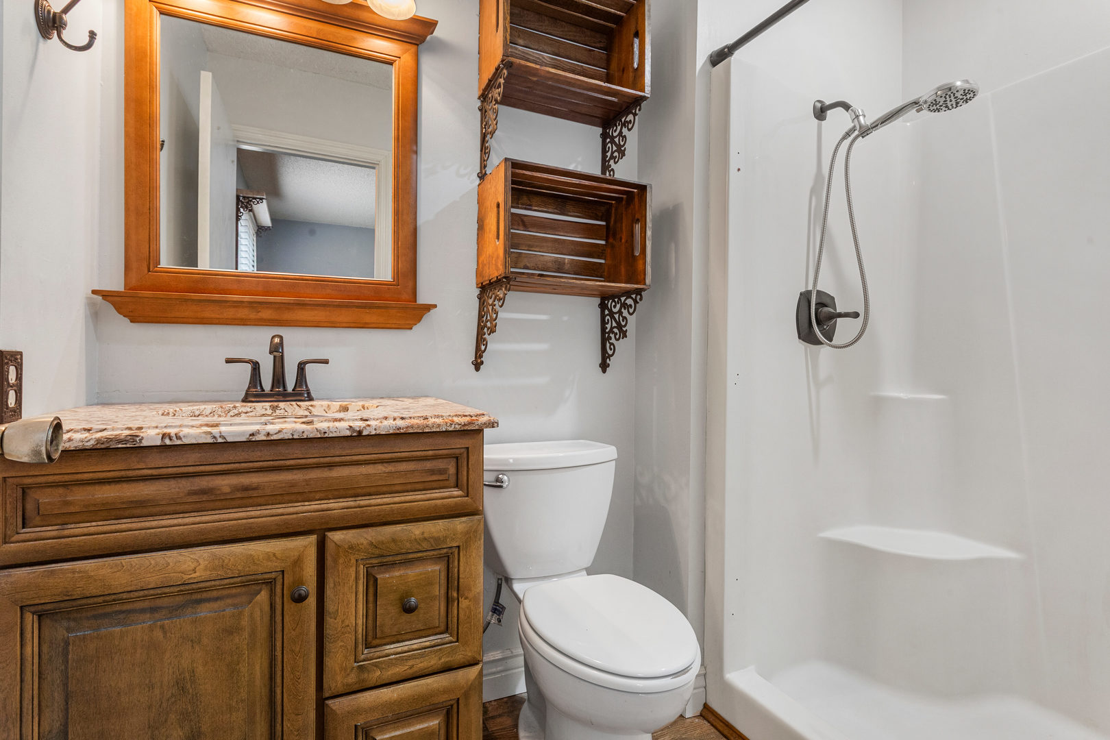2211 Carlisle Drive Champaign, IL 61821 - Photo 20 of 34 a bathroom with a toilet sink a mirror and shower