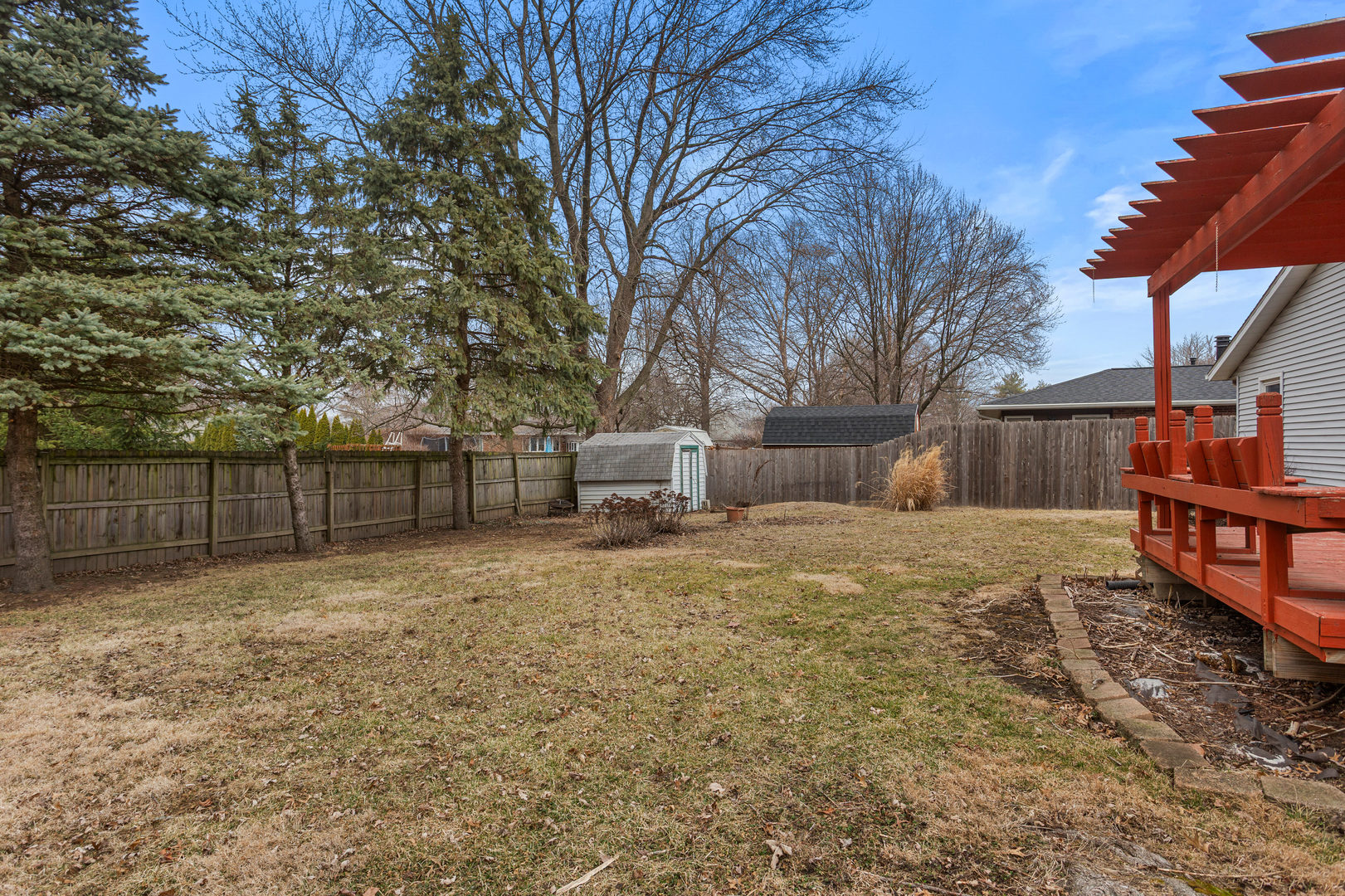 2211 Carlisle Drive Champaign, IL 61821 - Photo 32 of 34 a backyard of house with swing and slide