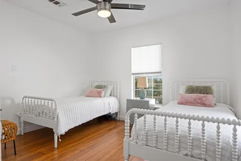 a bedroom with a bed and window