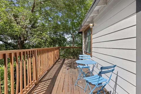 a view of a balcony with wooden floor