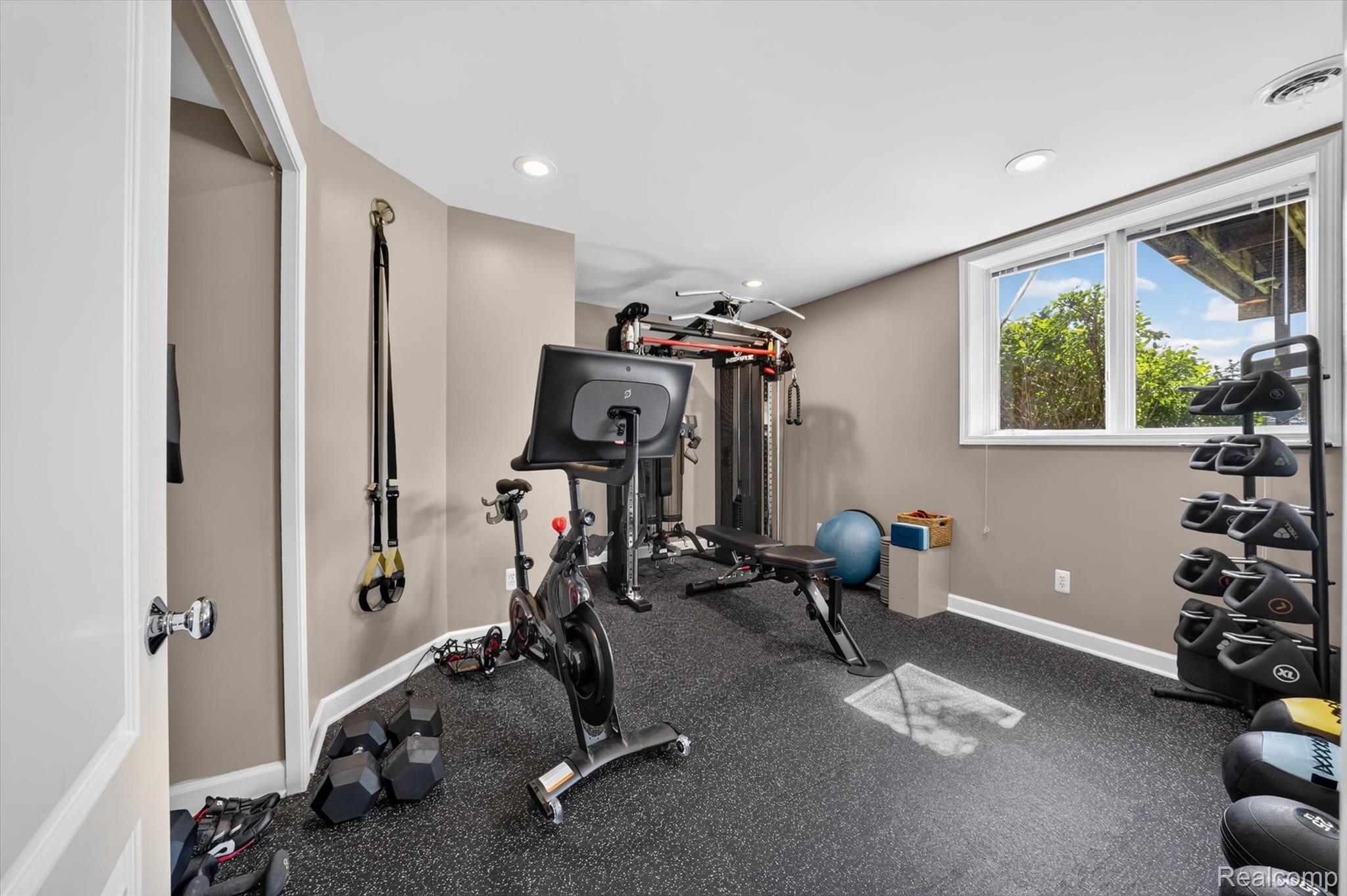 3804 Elk Drive Rochester, MI 48306 - Photo 49 of 75 Finished room (guest rm., hobby room or home gym) featuring resilient rubber flooring, recessed lighting, double-hung windows, and a neutral wall color