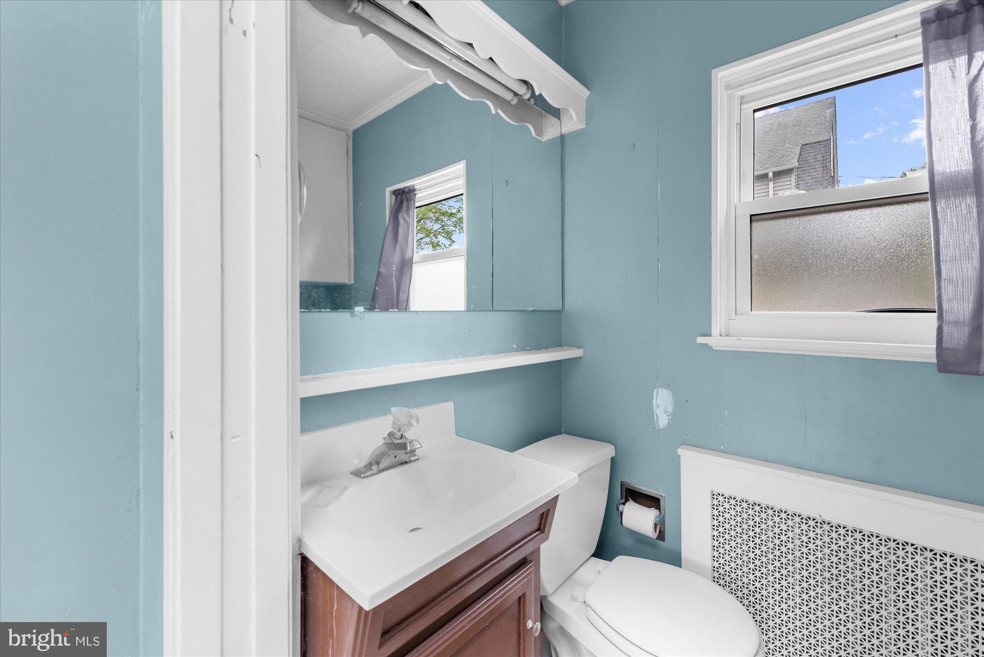 305 Lansdowne Road Havertown, PA 19083 - Photo 17 of 45 a bathroom with a sink a toilet and mirror