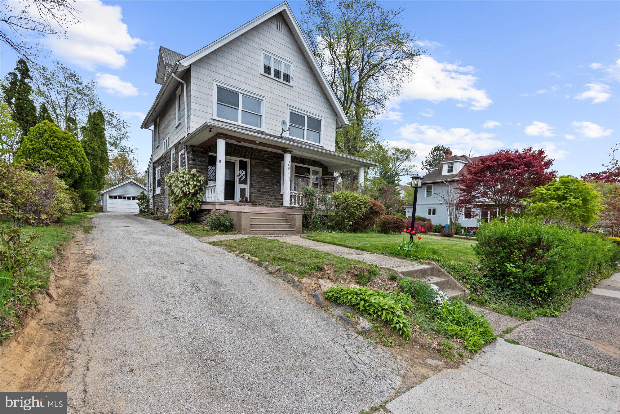 305 Lansdowne Road Havertown, PA 19083 - Photo 3 of 45 a front view of a house with garden