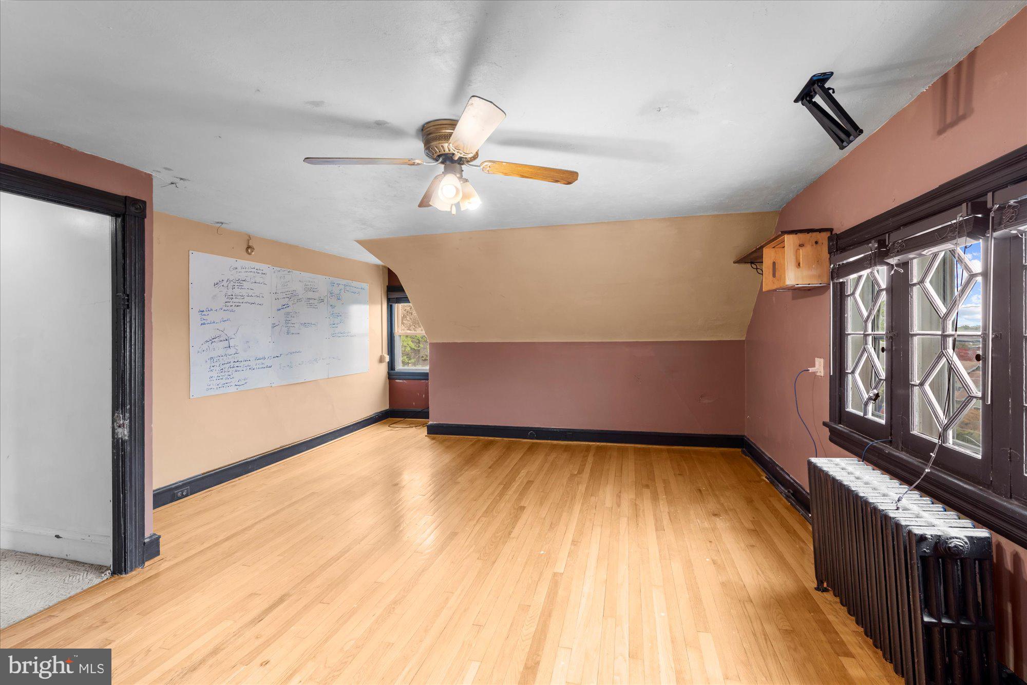 305 Lansdowne Road Havertown, PA 19083 - Photo 35 of 45 a view of empty room with wooden floor and fan