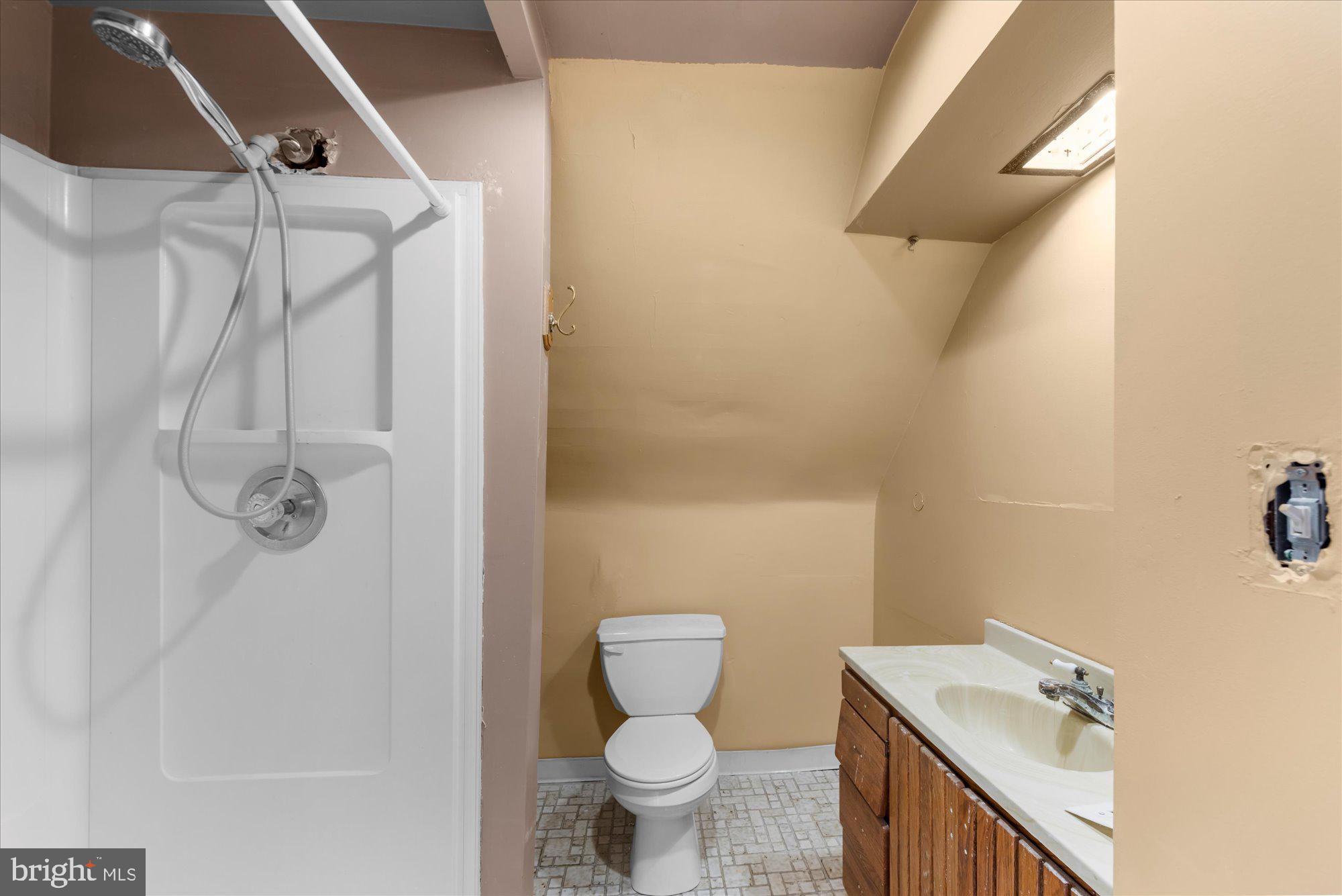 305 Lansdowne Road Havertown, PA 19083 - Photo 36 of 45 a bathroom with a sink a toilet and shower
