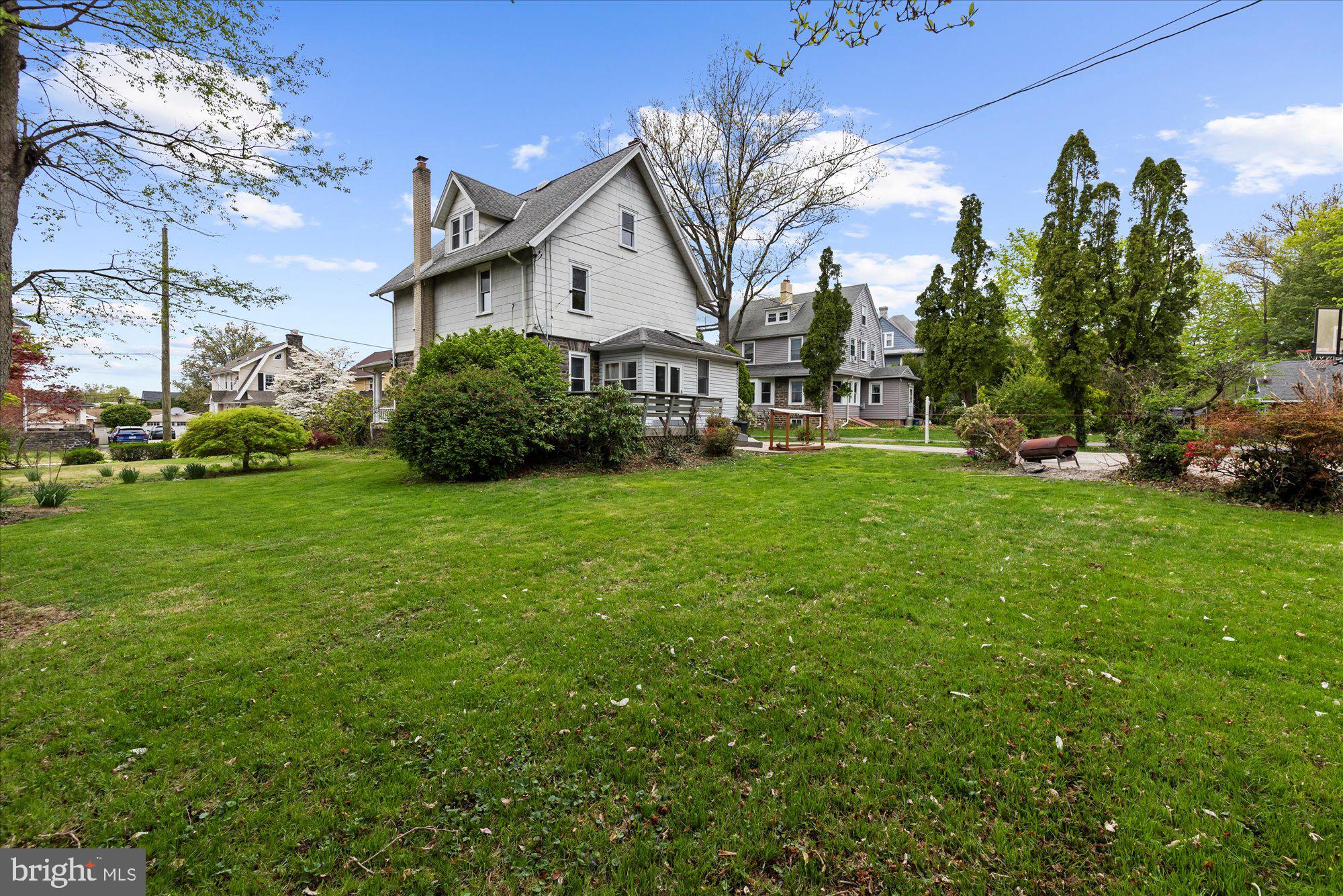 305 Lansdowne Road Havertown, PA 19083 - Photo 7 of 45 a view of a house with a big yard and large trees