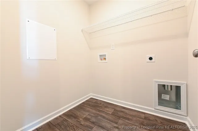 a view of a small space with wooden floor