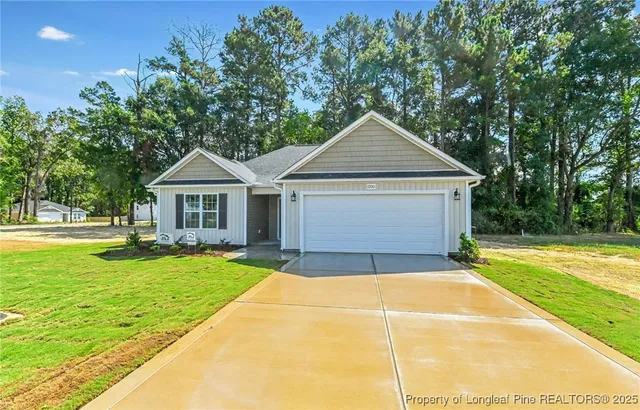a front view of a house with yard