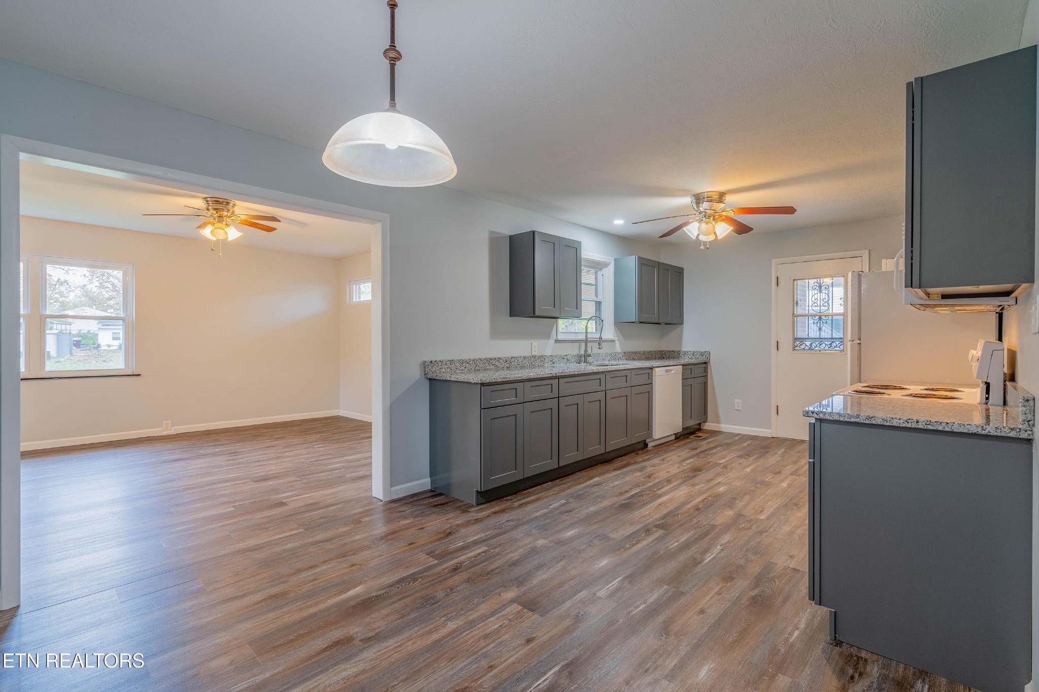 115 Manchester Road Oak Ridge, TN 37830 - Photo 11 of 22 a kitchen with a sink and wooden floor