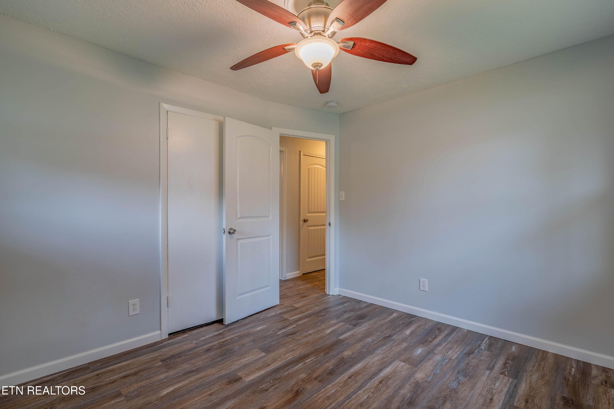 115 Manchester Road Oak Ridge, TN 37830 - Photo 16 of 22 a view of an empty room and wooden floor