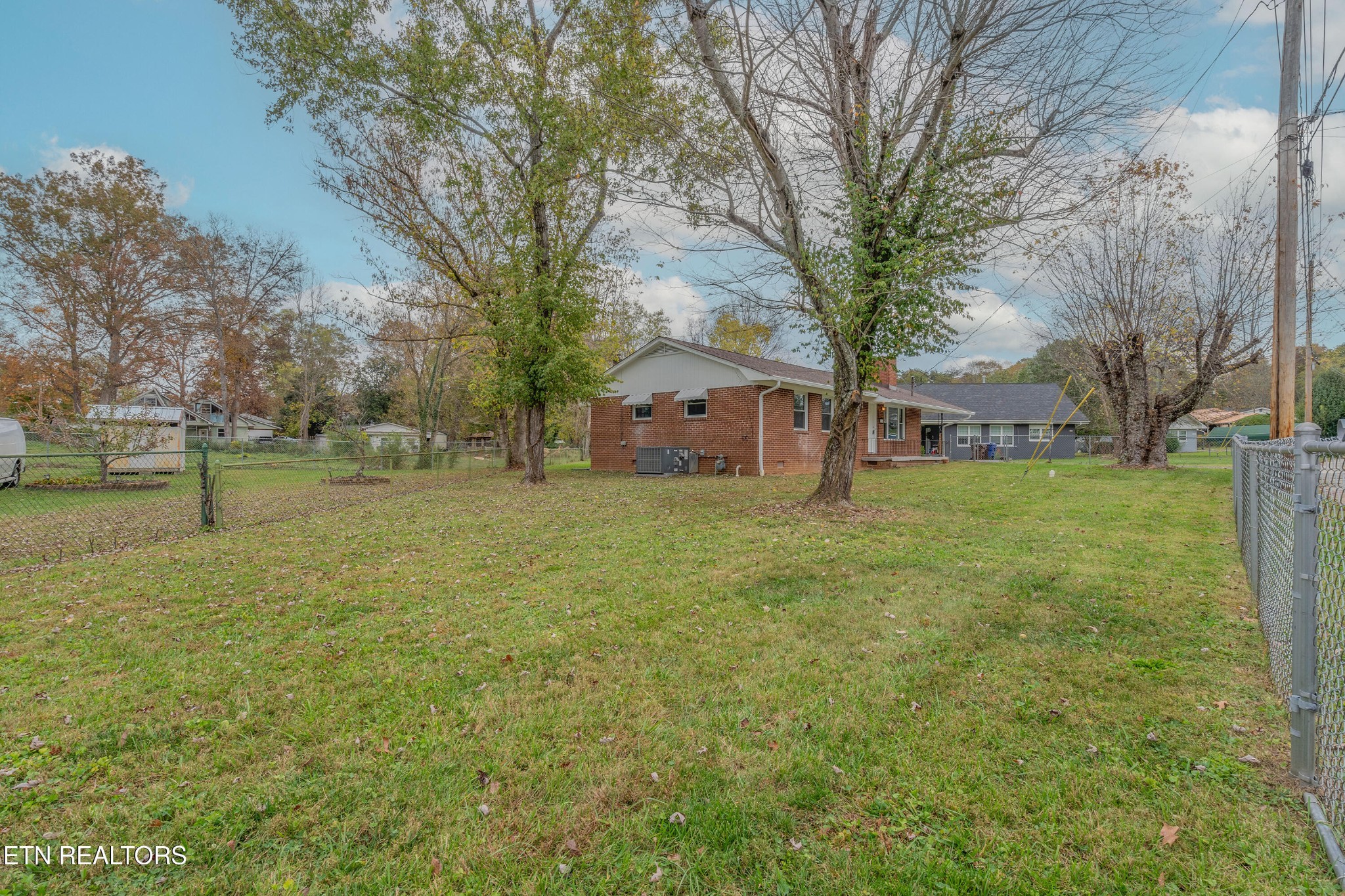 115 Manchester Road Oak Ridge, TN 37830 - Photo 22 of 22 a view of a tree in front of a house