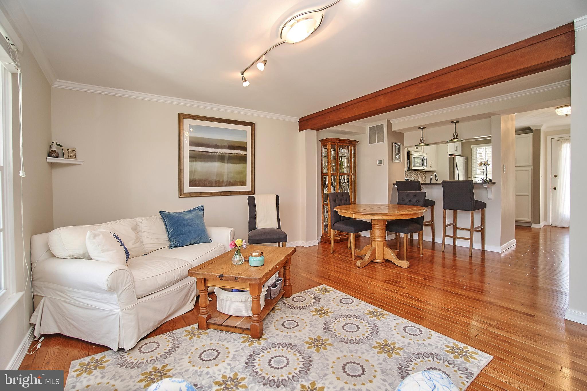 1903 Belmont Ridge Court Reston, VA 20191 - Photo 12 of 29 Exposed beam and quartz breakfast bar