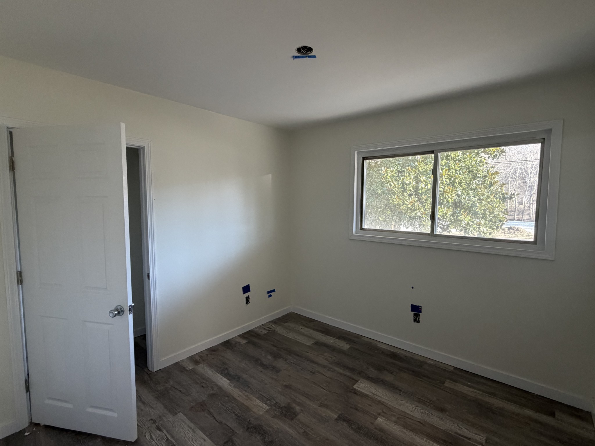 951 State Highway 99 Waynesboro, TN 38485 - Photo 21 of 27 an empty room with wooden floor and windows