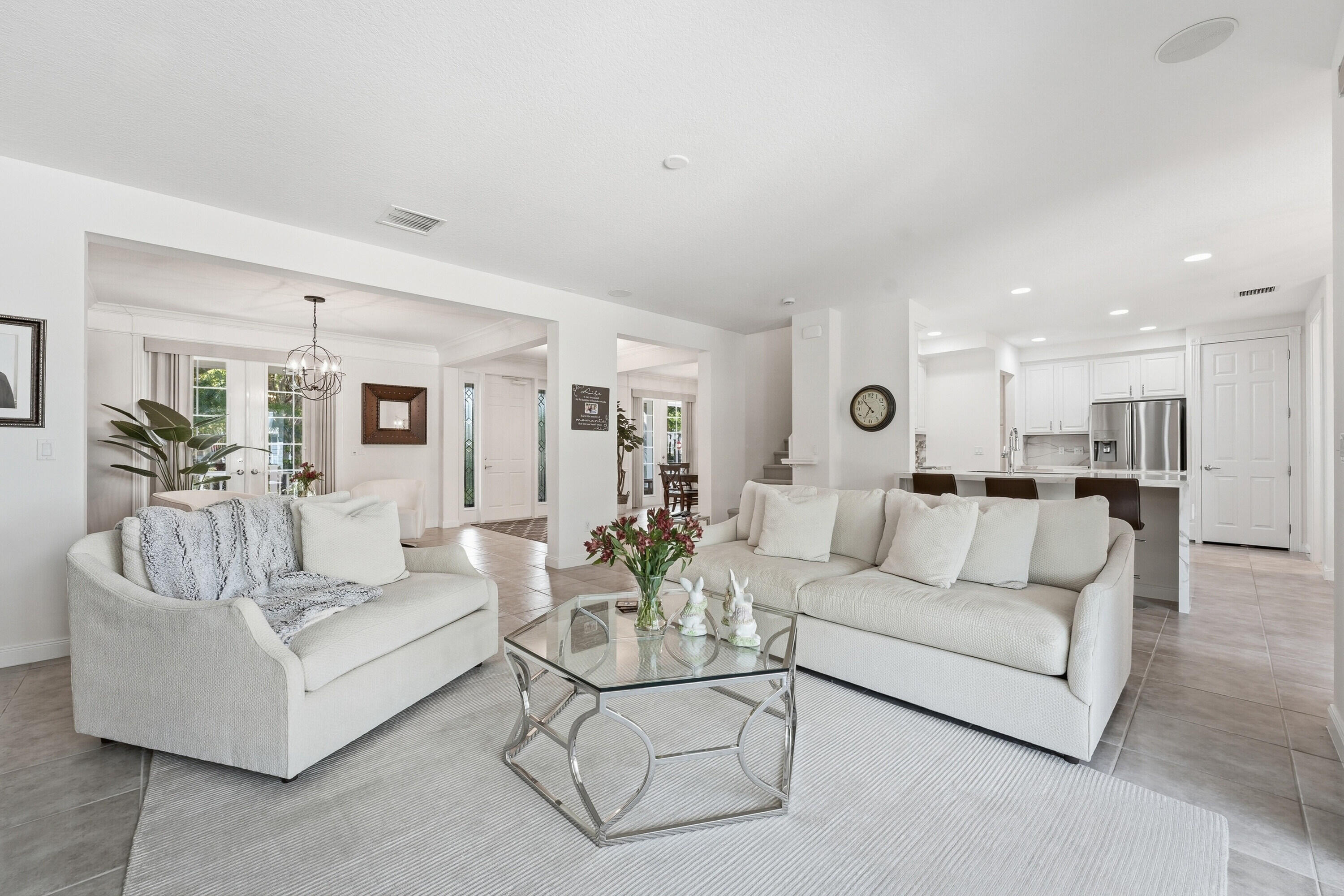 3443 South Caroline Street Jupiter, FL 33458 - Photo 11 of 60 a living room with furniture and white walls