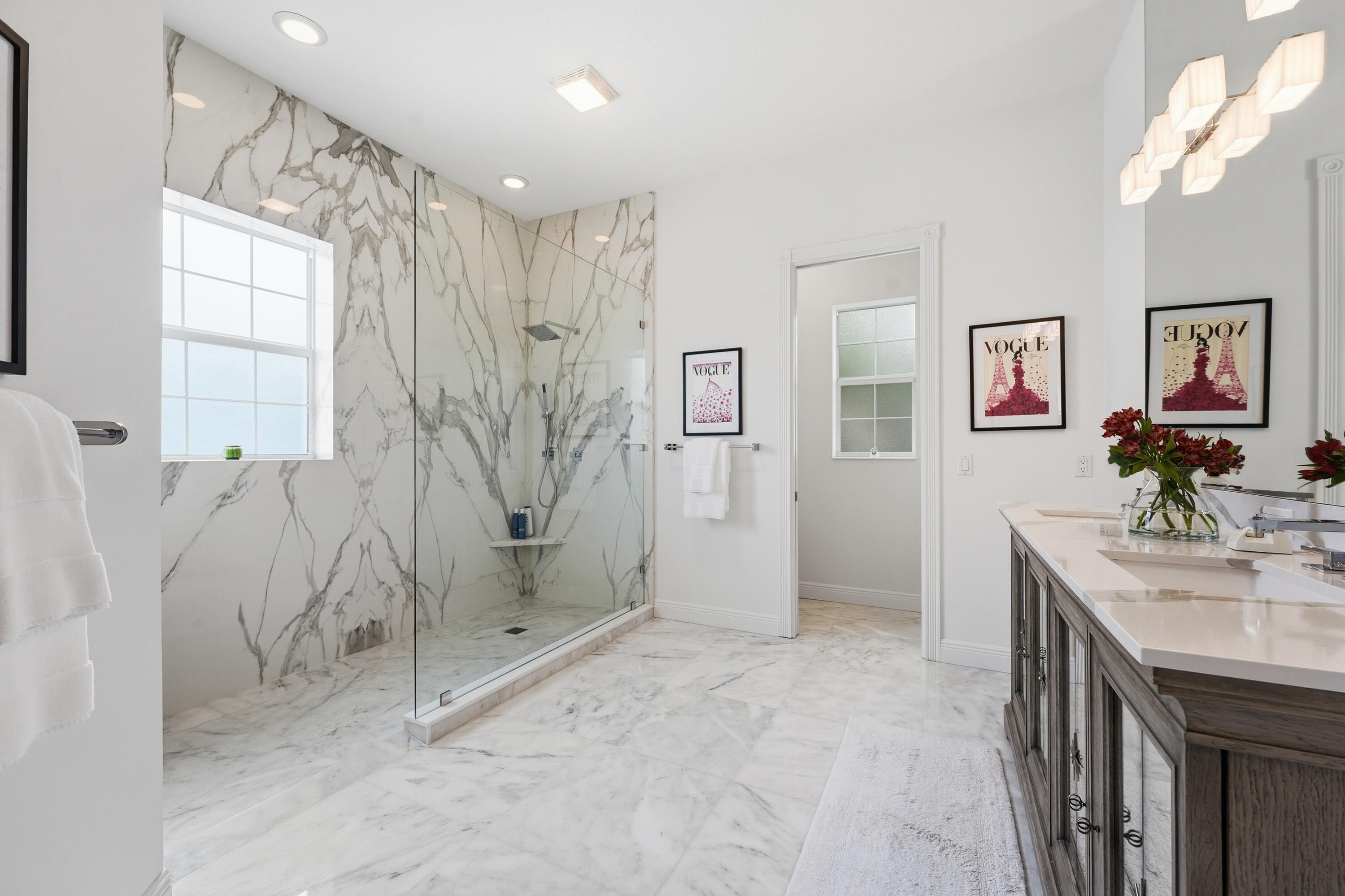 3443 South Caroline Street Jupiter, FL 33458 - Photo 20 of 60 a bathroom with a double vanity sink mirror and shower