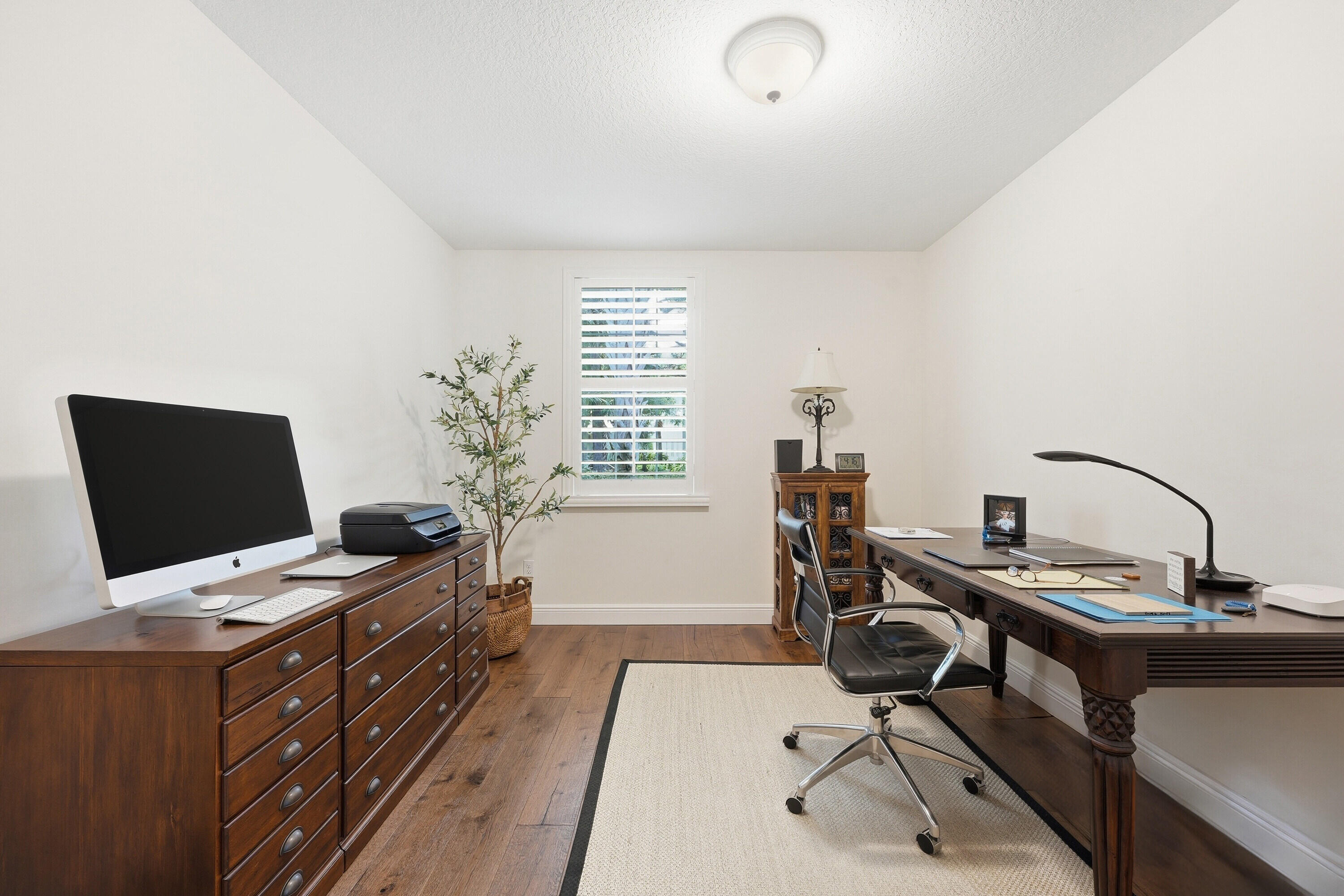 3443 South Caroline Street Jupiter, FL 33458 - Photo 23 of 60 a view of a workspace with furniture and a window