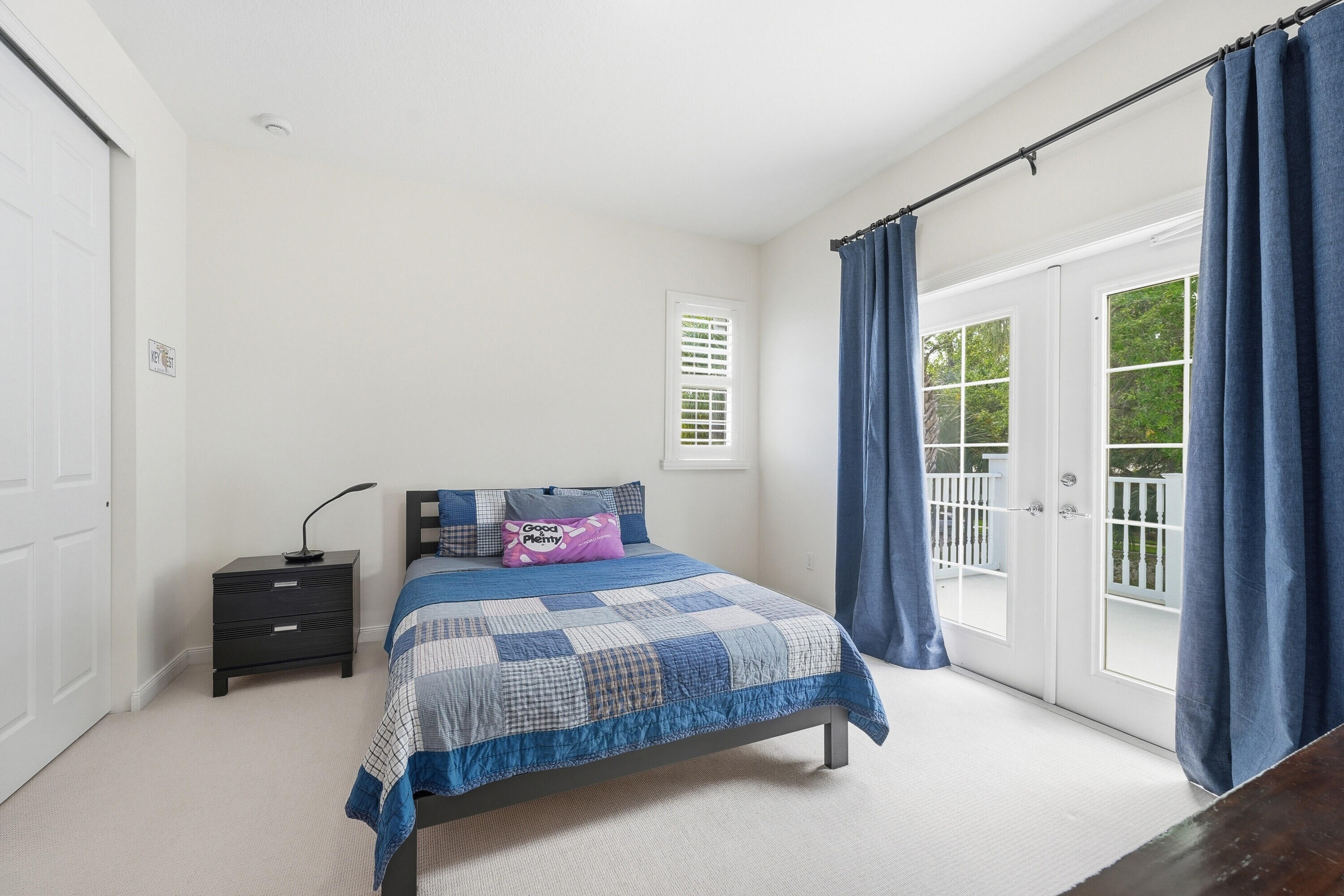 3443 South Caroline Street Jupiter, FL 33458 - Photo 27 of 60 a bedroom with a bed and with a window