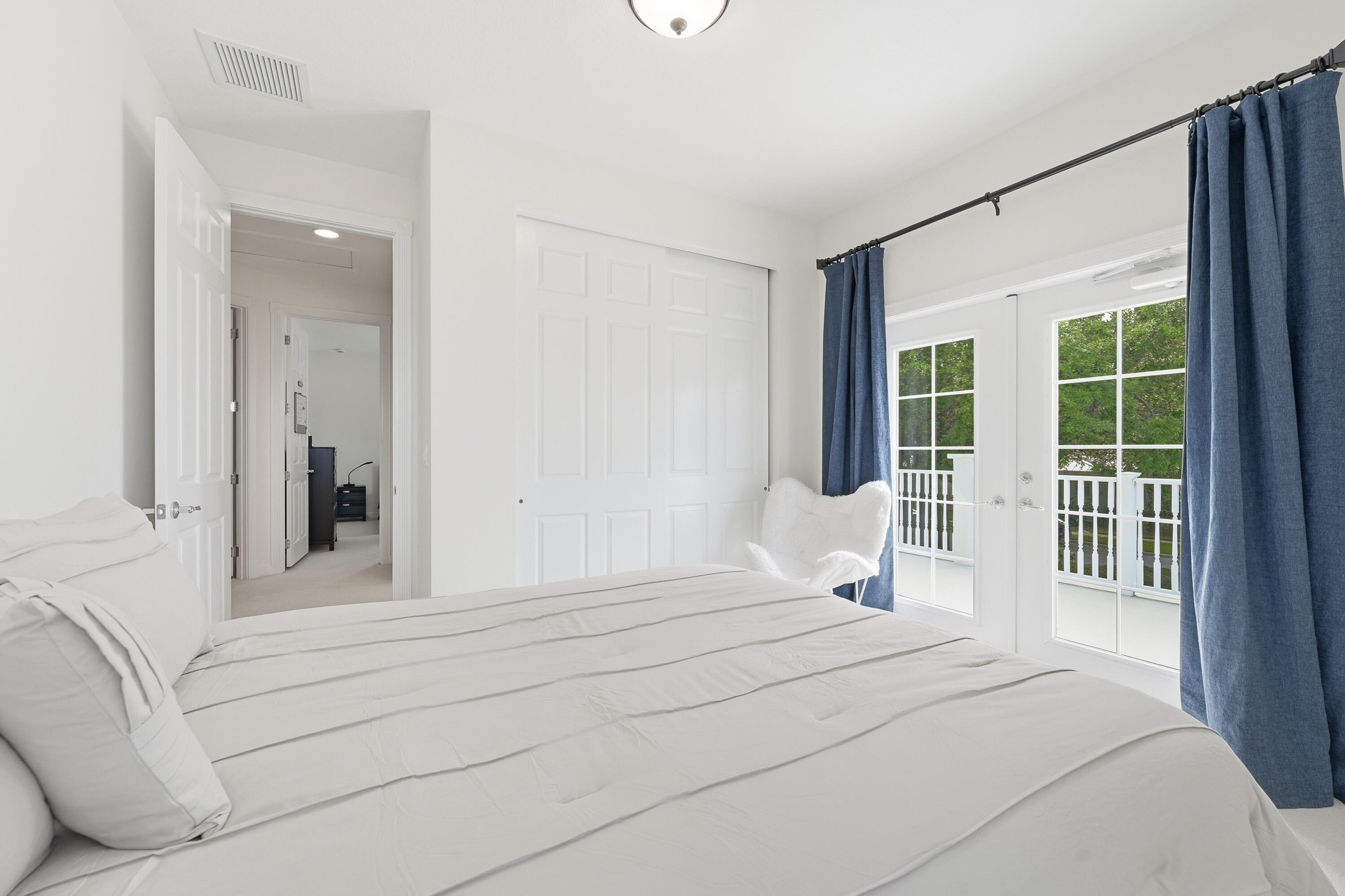 3443 South Caroline Street Jupiter, FL 33458 - Photo 30 of 60 a bedroom with a large bed and a window