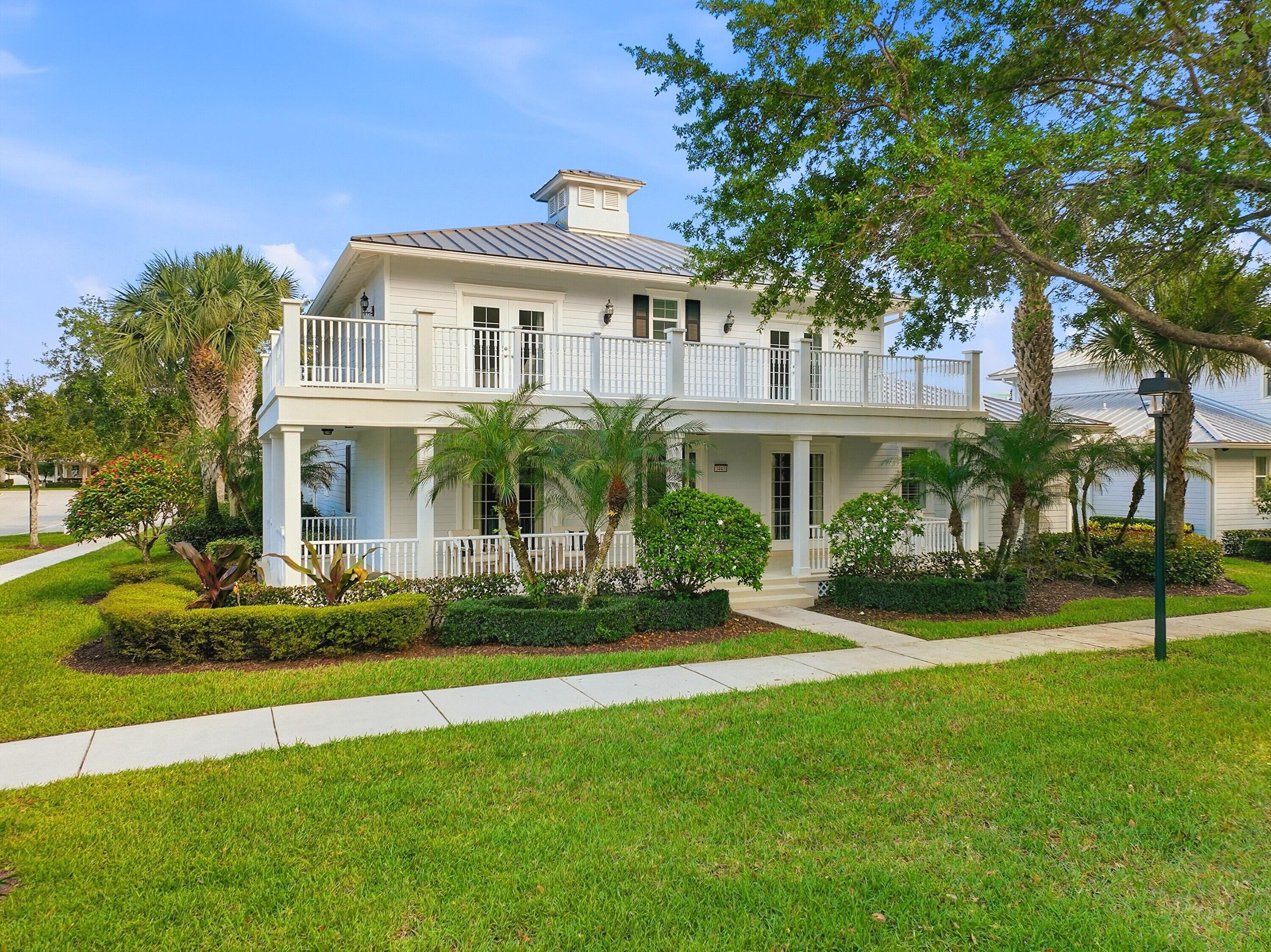 3443 South Caroline Street Jupiter, FL 33458 - Photo 3 of 60 a front view of a house with a yard
