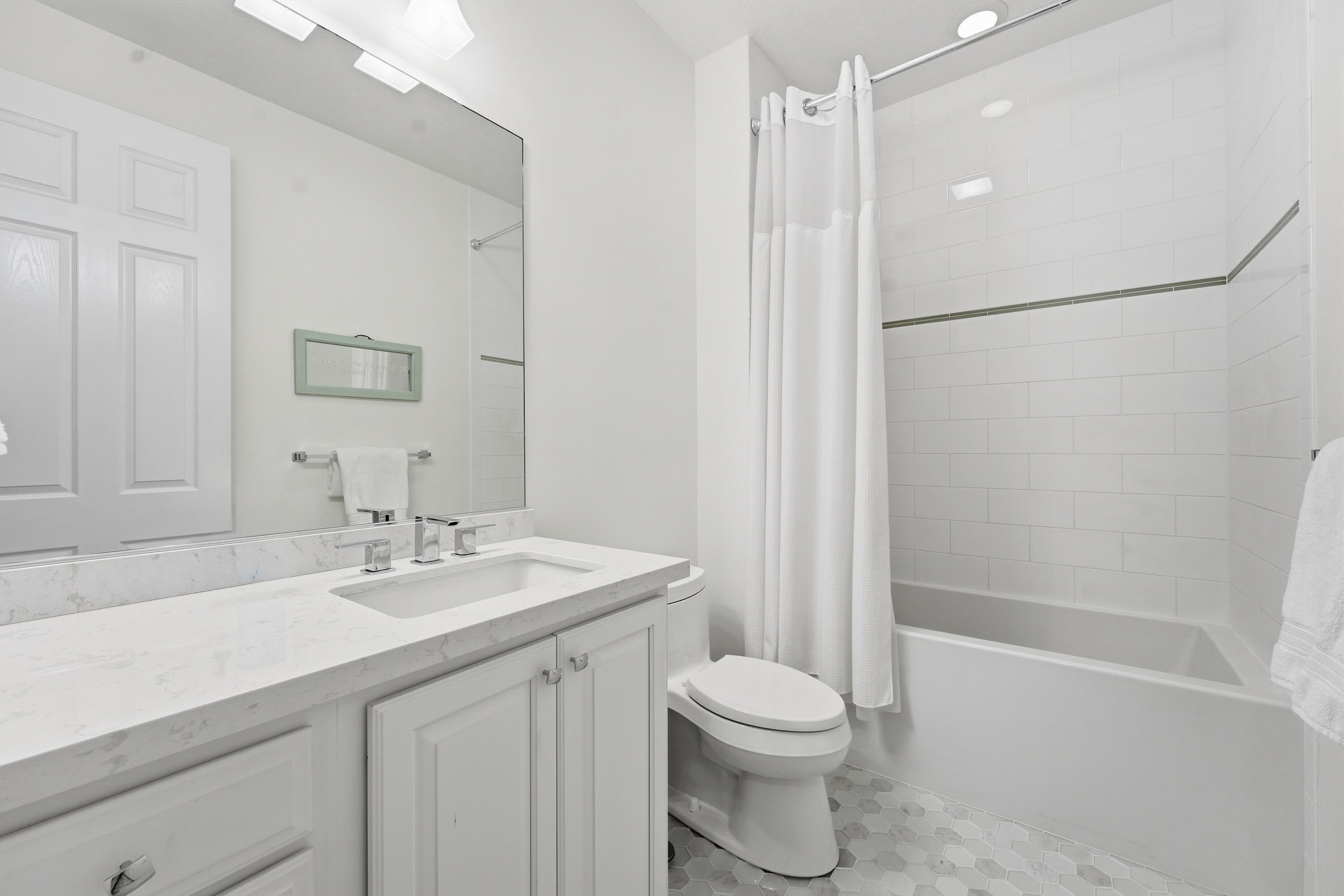 3443 South Caroline Street Jupiter, FL 33458 - Photo 35 of 60 a bathroom with a sink a toilet and shower