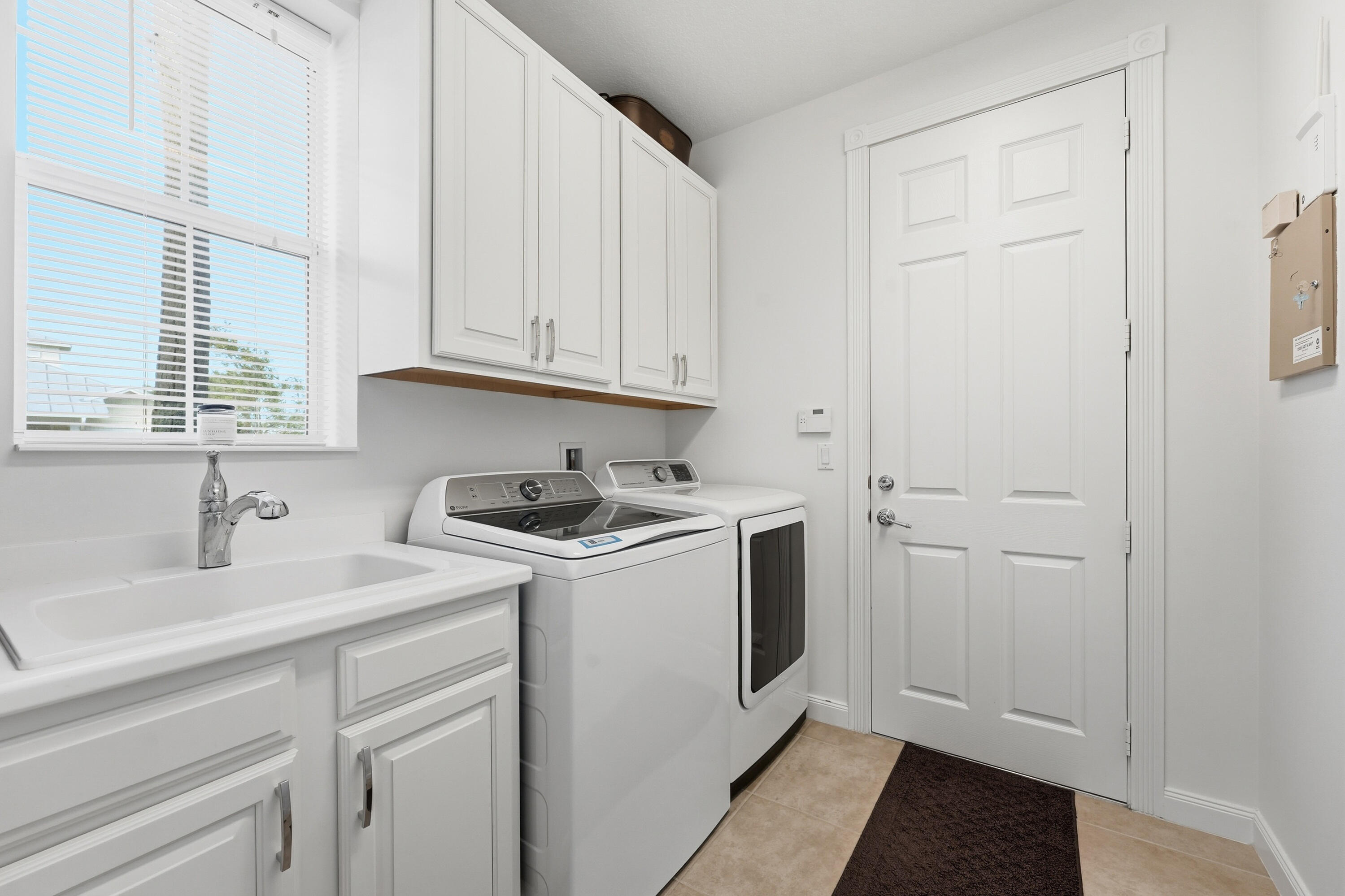 3443 South Caroline Street Jupiter, FL 33458 - Photo 36 of 60 a view of a storage and utility room with a sink