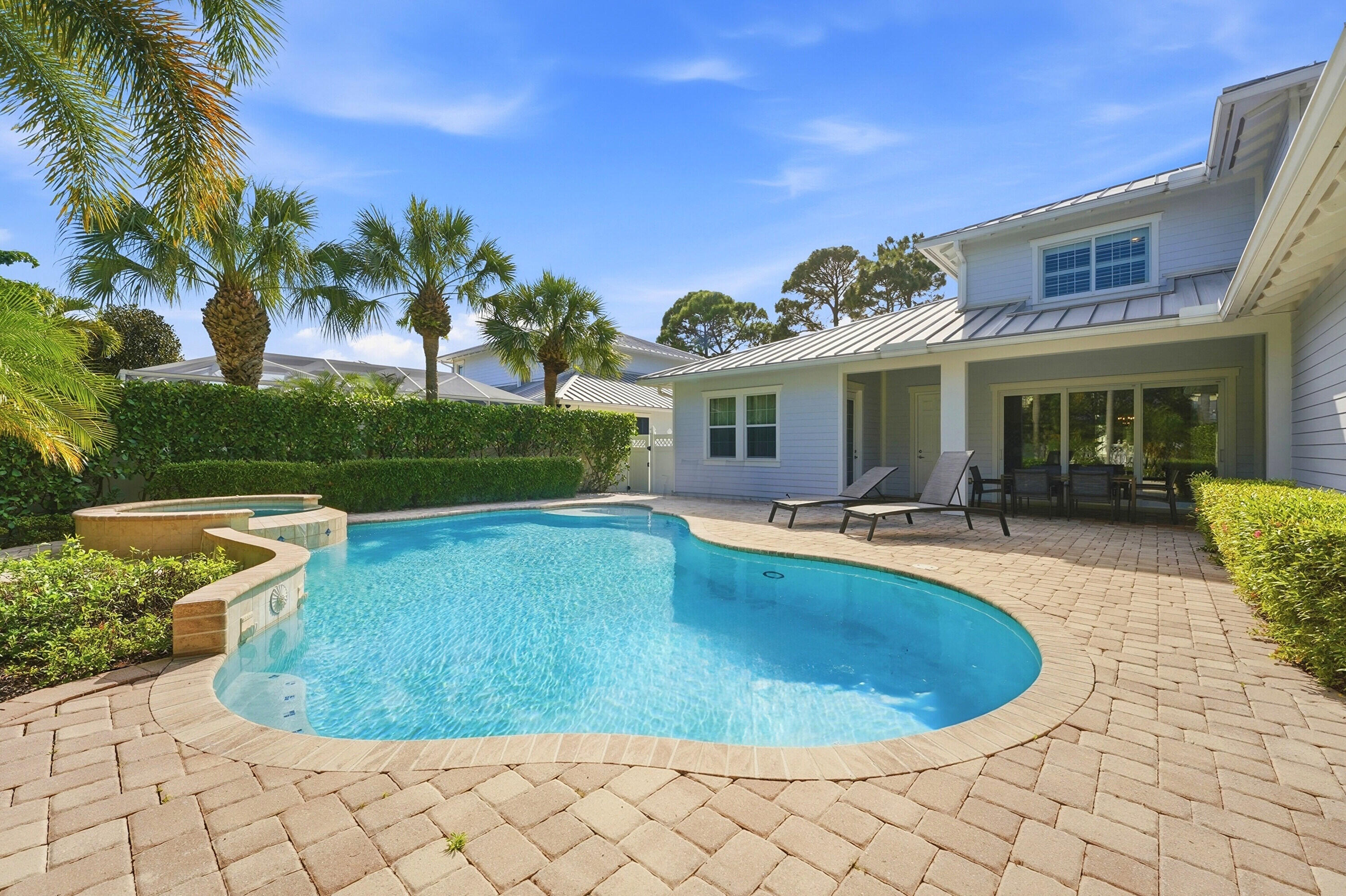 3443 South Caroline Street Jupiter, FL 33458 - Photo 40 of 60 a view of a house with swimming pool and a yard