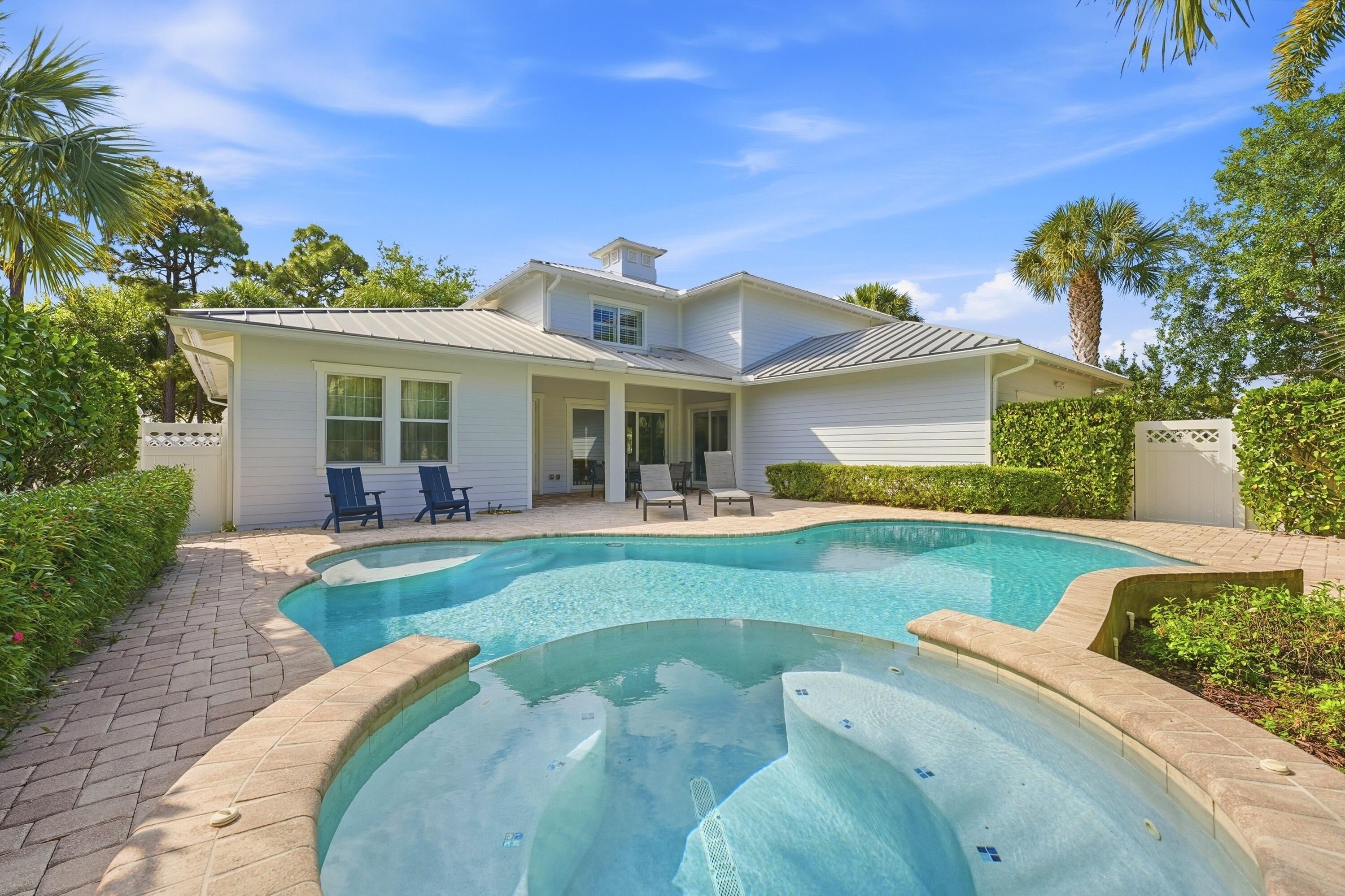 3443 South Caroline Street Jupiter, FL 33458 - Photo 41 of 60 a view of a house with swimming pool and porch