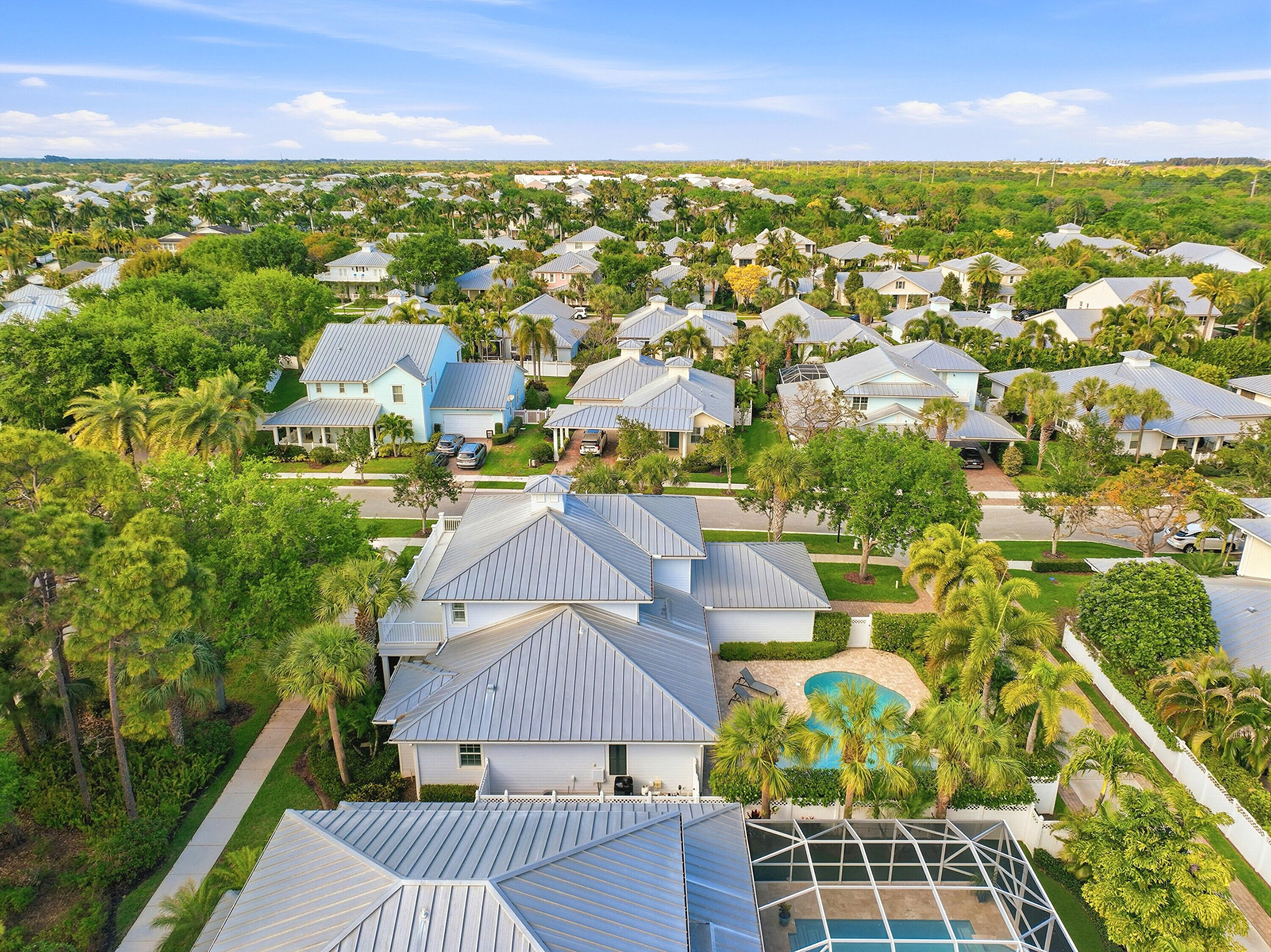 3443 South Caroline Street Jupiter, FL 33458 - Photo 50 of 60 an aerial view of residential houses with outdoor space and trees