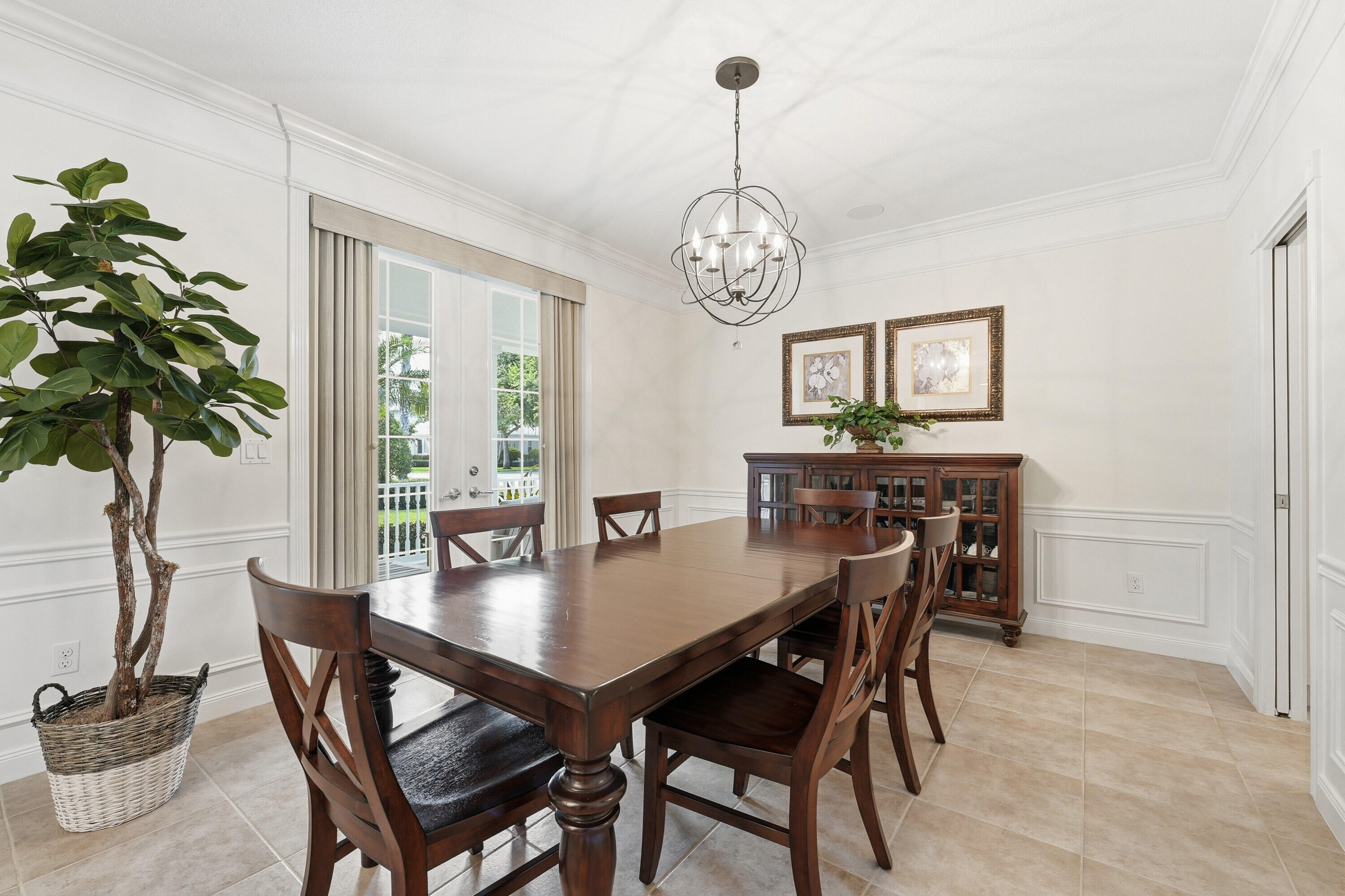 3443 South Caroline Street Jupiter, FL 33458 - Photo 7 of 60 a view of a dining room with furniture window and wooden floor