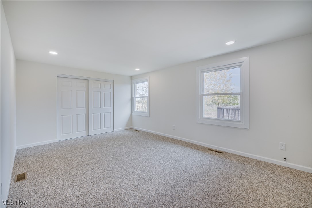 24534 Mill Road Utica, OH 43080 - Photo 10 of 38 Unfurnished bedroom featuring carpet floors, multiple windows, recessed lighting, and a closet