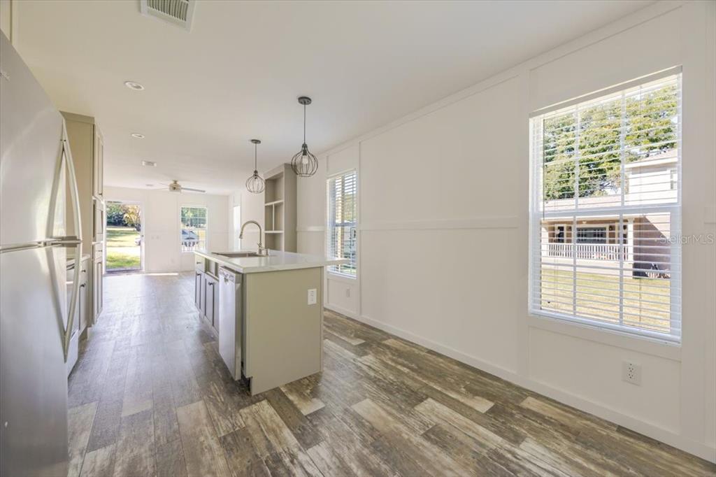 326 Smith Road Polk City, FL 33868 - Photo 19 of 26 a view of a kitchen with wooden floor