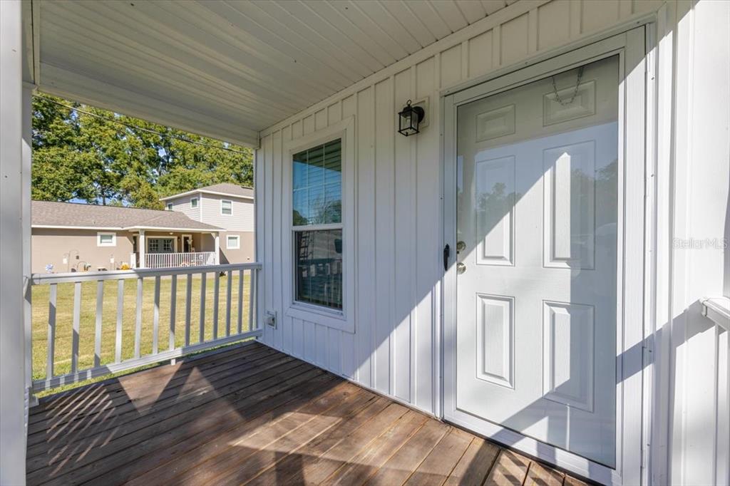 326 Smith Road Polk City, FL 33868 - Photo 4 of 26 a view of a house with a balcony